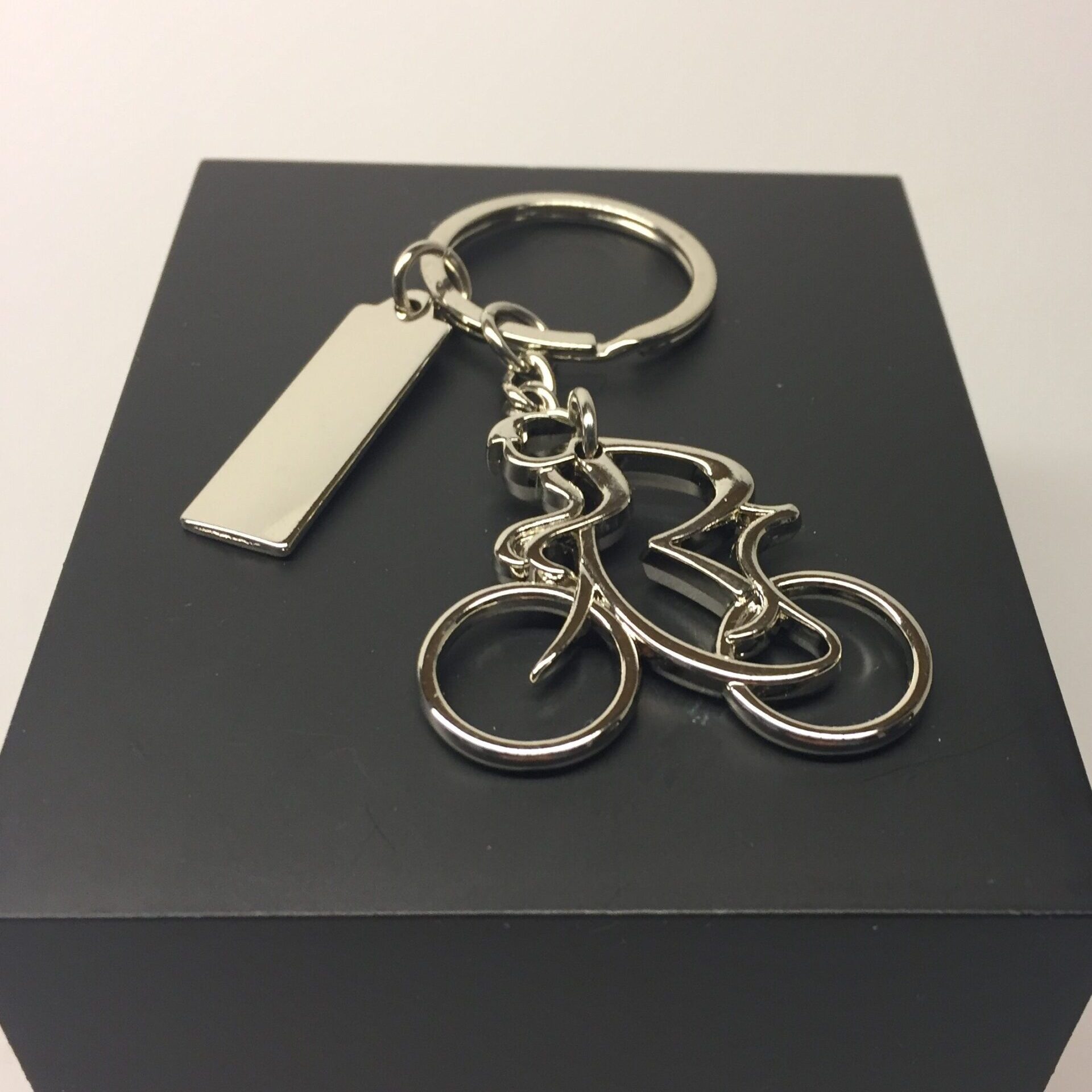 Nøglering - Cykelrytter blank med skilt