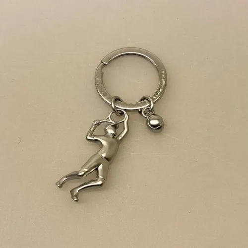 Nøglering Tennisspiller med bold, tennis, tennisspil, tennisspiller, tennisnøglering, ting med, tennisbold, gave, gaveide, tennistræner, tennisklub, tennisketcher, tennisbane, court, tennisudstyr, symbolsk, personlig, sangskjuler, tennissport, dtu, wosniaki, winbeldon, williams, biti, ribe, design, flot, kvalitet, gavekort, konfirmand, konfirmation,