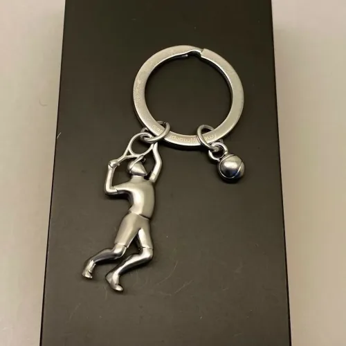 Nøglering Tennisspiller med bold, tennis, tennisspil, tennisspiller, tennisnøglering, ting med, tennisbold, gave, gaveide, tennistræner, tennisklub, tennisketcher, tennisbane, court, tennisudstyr, symbolsk, personlig, sangskjuler, tennissport, dtu, wosniaki, winbeldon, williams, biti, ribe, design, flot, kvalitet, gavekort, konfirmand, konfirmation,