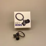 Nøglering - Kamera blank oxideret, selfie, SOME, insta, instagram, poste, foto, fotos, fotografering, fotograf, symbolsk, gave, gaveide, særlig, personlig, photo, fotograf, lækker, biti, ribe, fotoudstyr, linse, zoom, optisk, linse, linselus, portræt, fotostudie