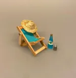 Miniature Liggestol Lille Blå, lyseblå, ensfarvet, strandstol, solstol, sol, strand, sjov, miniature, 1:12, lillebitte, sangskjuler, symbolsk, gave, gavekort, gaveide, otium, efterløn, solferie, bryllupsrejse, dase, ferie, charter, rejse, pension, biti, ribe, dukkehus, dukkehustilbehør, dukkehusting, nisser, nissetilbehør, festival, festivalstol, grøn, koncert