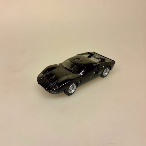 Modelbil Ford GT 40 - Sort, black rider, butterfly, døre, gti, old timer, old school, cool, hurtig, racer, racerbil, sportsvogn, benzin, fast car, modelbil, samler, mekaniker, kørekort, 18 år, symbolsk gave, gaveide, tillykke, drengerøv, drengebil, kontor, ungdom, biti, ribe, legendarisk, flot, sej, racerkører, le mans, formel 1,