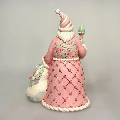 Jim Shore Heartwood Creek 24 cm Julemand - Sweet.sweet treat santa, 6017018, pastelfarvet, cotton candy, slik, sukker, den store bagedyst, meterværk, konditor, pasteljul, lyserød, rosa, yndig, lækker, herlig, sjov, særlig, unik, one of a kind, samler, julemand, figur, jim shore, heartwood creek, biti, ribe,