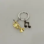 Nøglering Trompet & Node, trumpet, 401-01, messingblæser, trompetist, instrument, musikalsk, musik, elsker, musiker, konservatorie, jazz, jazzmusik, gave, symbolsk, lækker, kvalitet, pengegave, koncert, hornorkester, symfoni, orkester, nøglering, gave, musikgave, biti, ribe